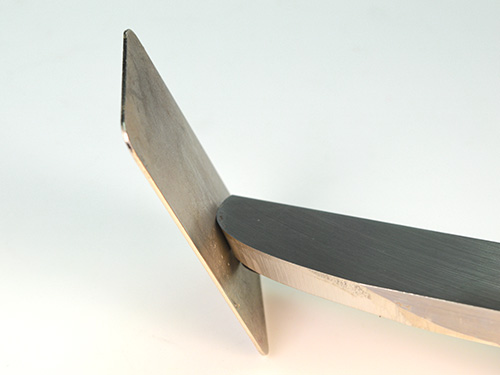 Sharpening a scraper with diamond card