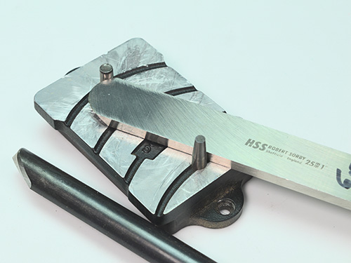 Shaping the burr on a scraper