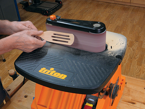 Sanding edges of spurtle smooth