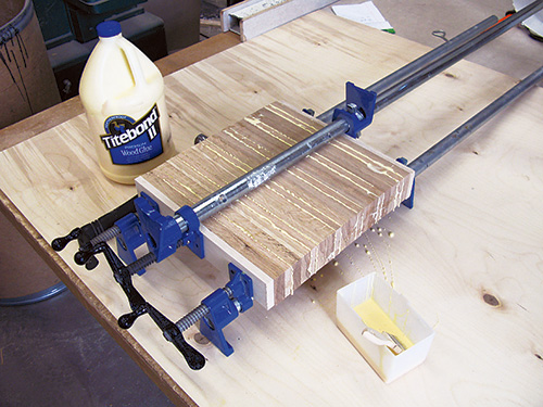 Kubb game pieces clamped and glued and pressed together