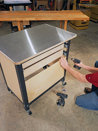 Installing back panel on shop cart