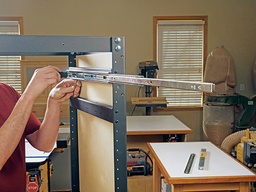 Extended drawer slides attached to shelving bracket