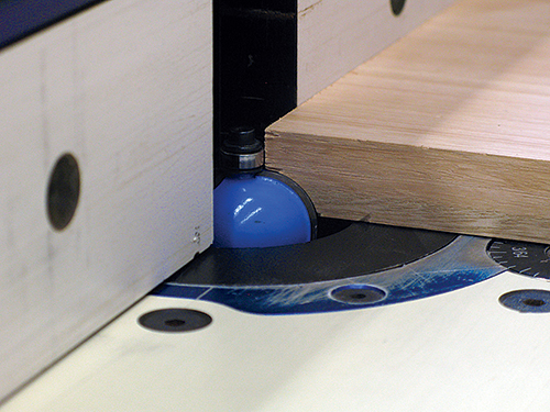 To add shape and shadows to the shelf, a 3/8" cove is routed into the edges and ends of the 3/4" stock. This works best on a router table but can also be done with a handheld router.