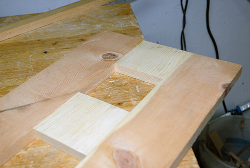 Scrap wood mock-up of flush-trim router jig