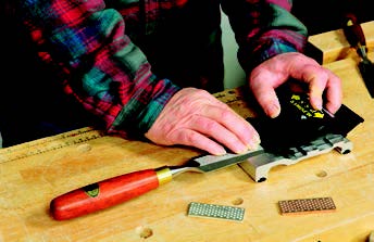 To use M-Power’s Precision Sharpening System (PSS) guide, you hold the tool stationary while you slide the guide’s head back and forth.