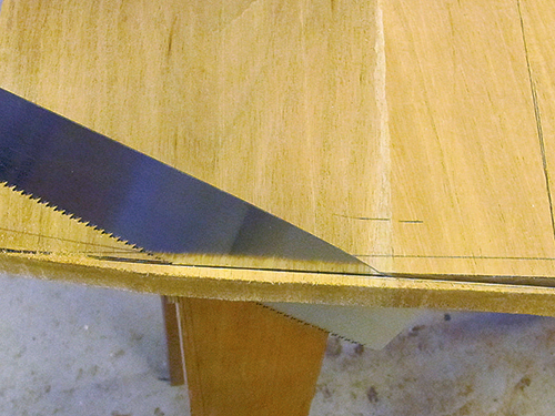 Using hand saw to cut curves in desktop