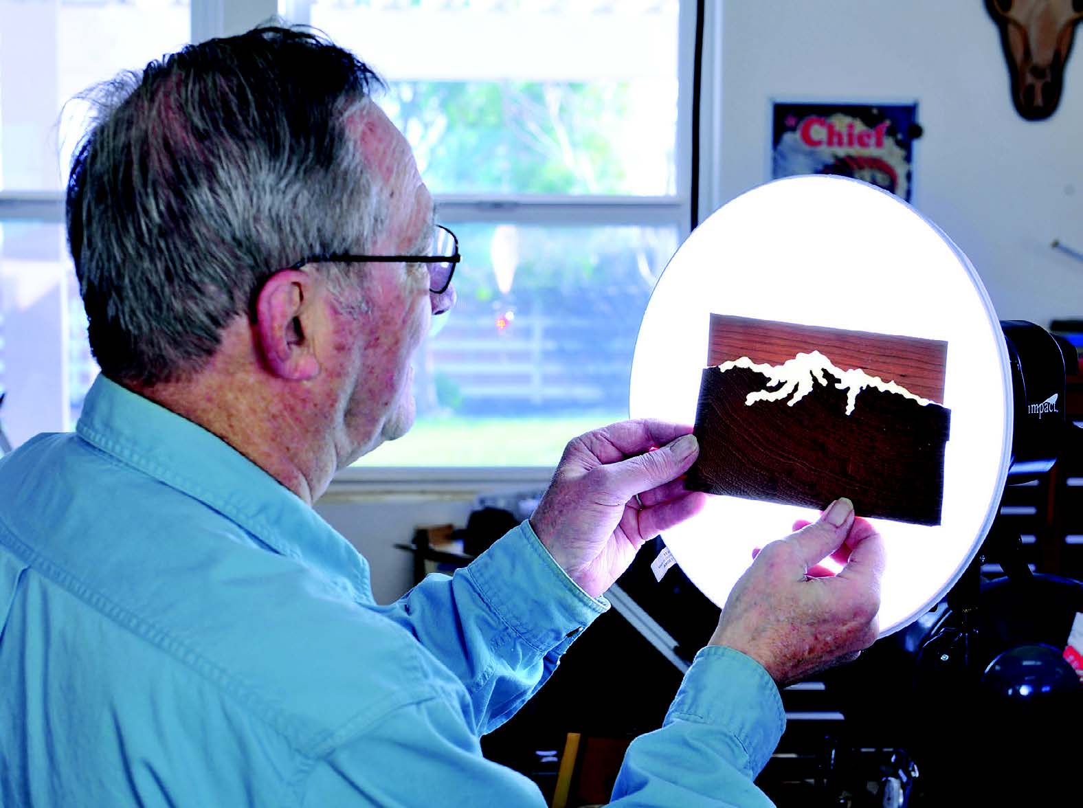 Previewing marquetry pieces fit over lamp