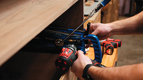 Clamping Rockler Drawer Slide Installation Jig on cabinet