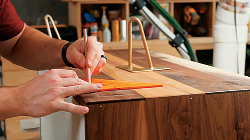 Marking out locations to install legs on Mid-century Modern Dresser