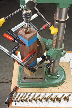 Drilling deep holes into the end grain of the corner block bundle is tough going. Work up in bit sizes if you have a modest drill press like this.