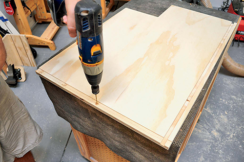 Pre-drilling pilot holes from the inside of the rabbet makes assembling the cabinet much easier.