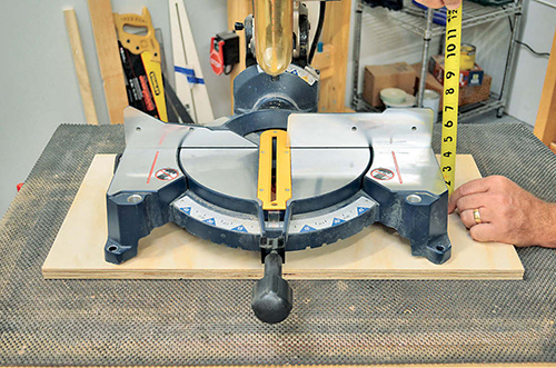Check the height of your miter saw bed to determine its placement between the cabinets.