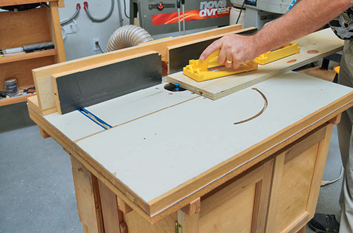 Mill grooves into the cut shelf, then form the T-slots at the router table.