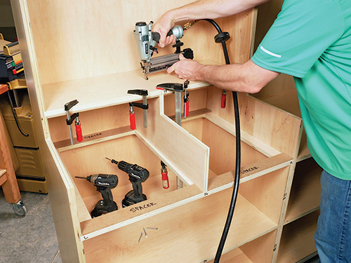 Nailing center divider for miter station in place