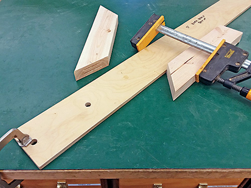 Clamping workpiece to rail for cutting biscuit slots