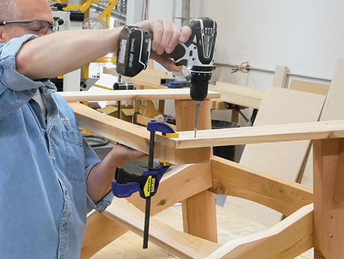 Fastening arms to Adirondack chair base