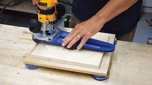 Using circle cutting jig to shape clock face