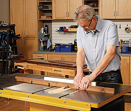 Making multiple half lap cuts on a slat with a cross lap jig on a table saw