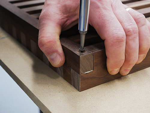 Screwing corner joints for modern coffee table into place