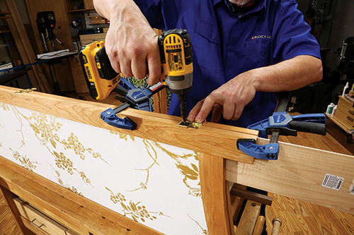 Attaching brass hinge to divider joint with screw