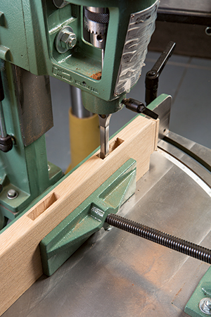 Chopping out mortises with a mortising machine