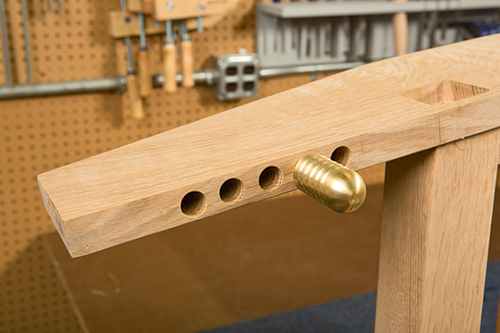 Installing brass pins in Morris chair