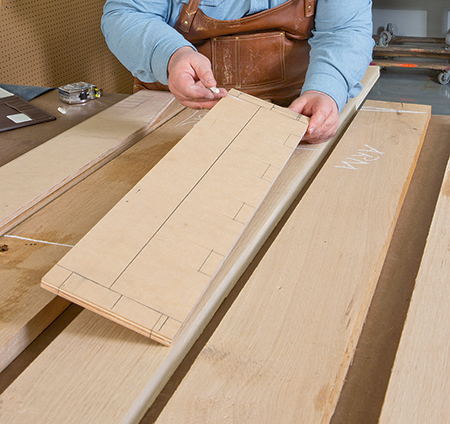 Marking cut lines on board for making chair parts