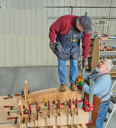 Man standing on top of steam bending box