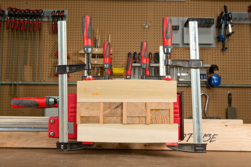 Side view of laminated leg clamping process