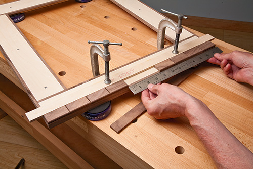Measuring and adjusting hardwood tiles on mosaic picture frame