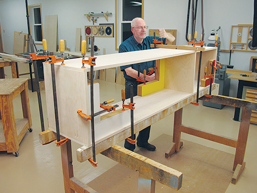 Dry assembly of Murphy bed cabinet hardware