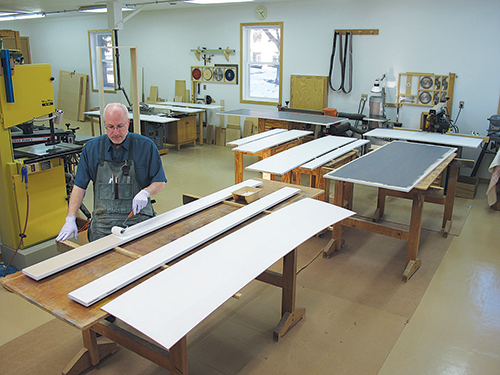 Laying out Murphy bed cabinet parts for painting