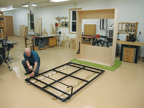 Laying out Murphy bed bedframe