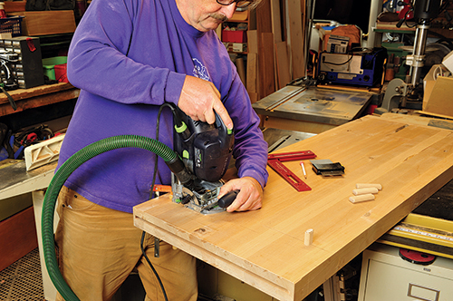 Cutting domino holes for attaching workbench storage to tabletop