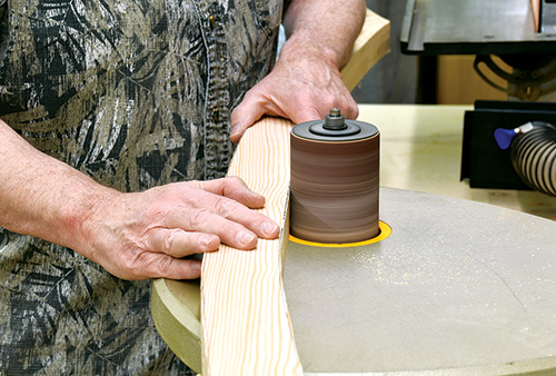 Smoothing interior side of plant stand leg