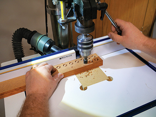Drilling out screw hole covers with drill press