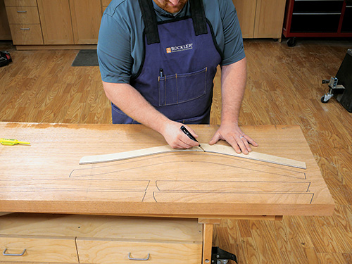 Marking out loveseat parts with template