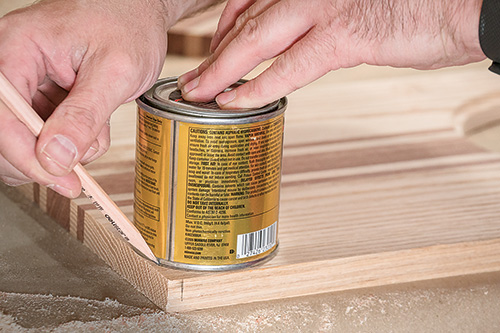 Using a finish can to mark out the rounded corners of a cutting board