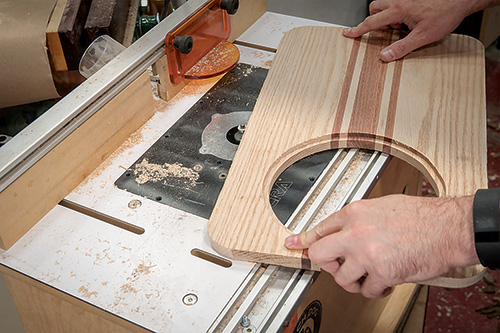 Using a roundover bit in a router table to round outer edges of cutting board