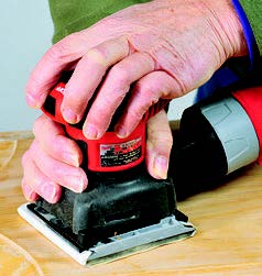 Quarter-sheet sanders can be gripped from the top or by the barrel. This helps to avoid fatigue.