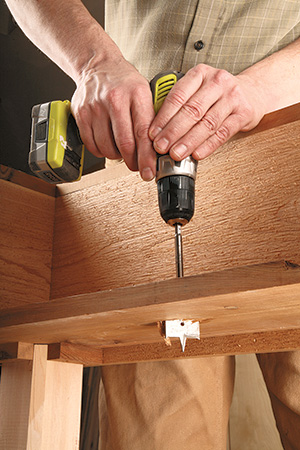 Drilling watering holes in base of planter cart