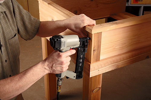 Attaching trim pieces to planter with nail gun