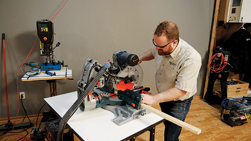 Cutting pine lumber for entry bench at miter saw