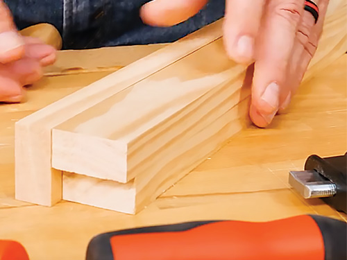 Aligning entry bench leg assembly using scrap wood spacer