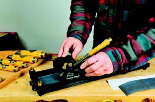 With the blade locked in place, you move the Pinnacle guide’s carriage back and forth over the whetstone during honing.