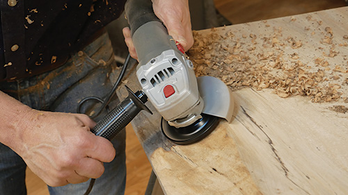 Smoothing weathered fibers from slab tabletop