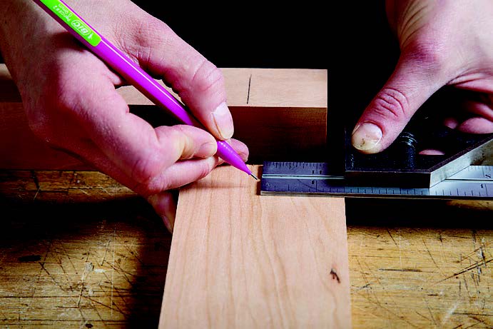 Marking placement of joinery on table leg