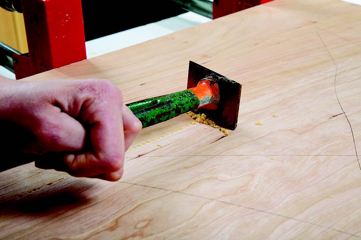 Smoothing tabletop panel with scraper