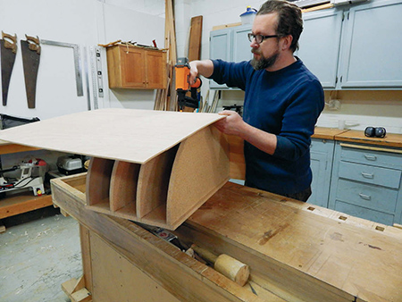 Fastening plywood panel to outside of vanity carcass