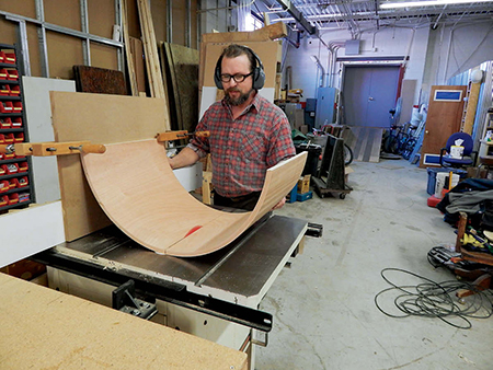 Cutting equal sides of curved panel to form doors